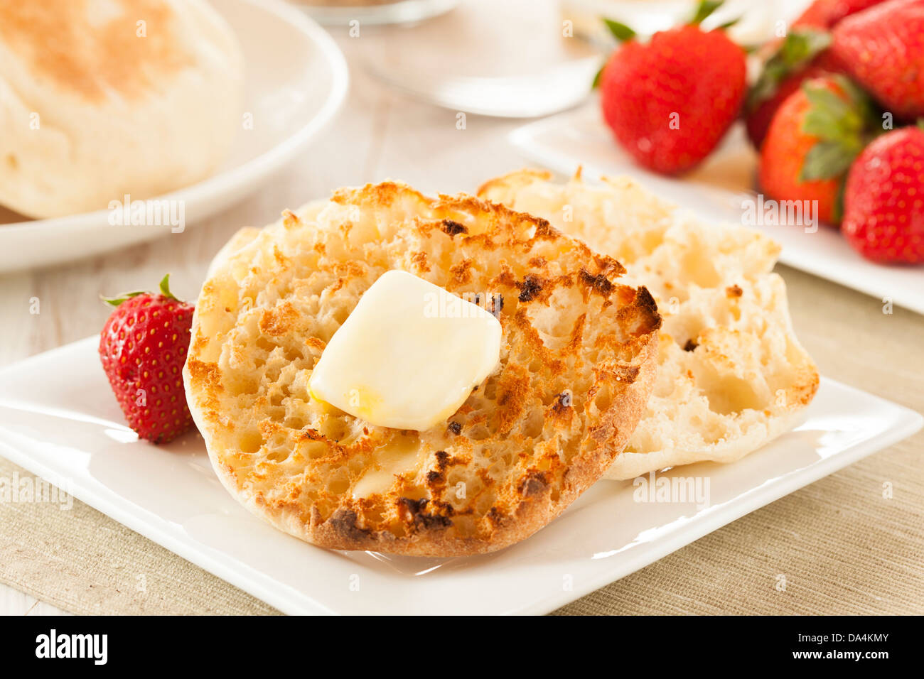 Organic Whole Wheat English Muffins with Butter Stock Photo Alamy