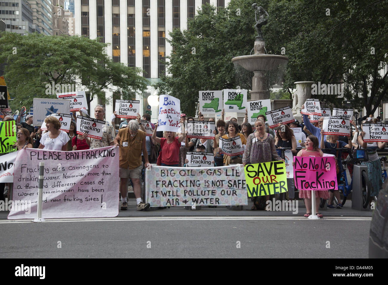 Environmental activists send a message to NY Gov. Andrew Cuomo outside the Plaza Hotel in NYC 'Don't  FRACK New York'. Stock Photo