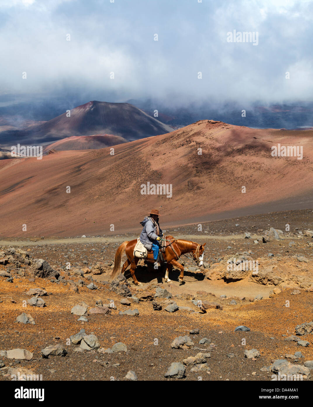 Horseback rider on the Sliding Sands Trail at Haleakala National Park Stock Photo