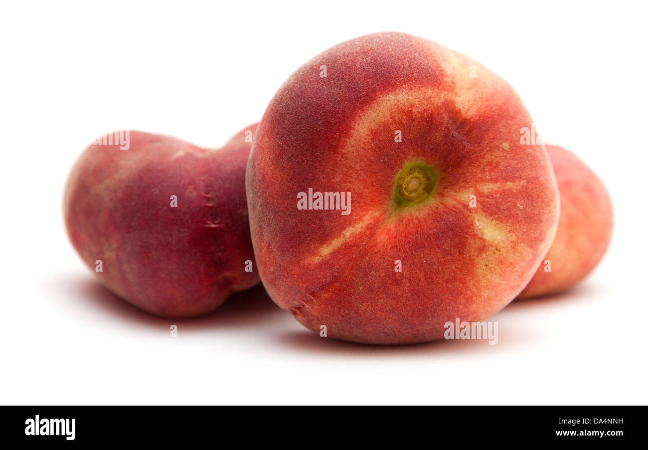 donut peaches isolated on white (Paraguayos; Saturn Peaches; Chinese