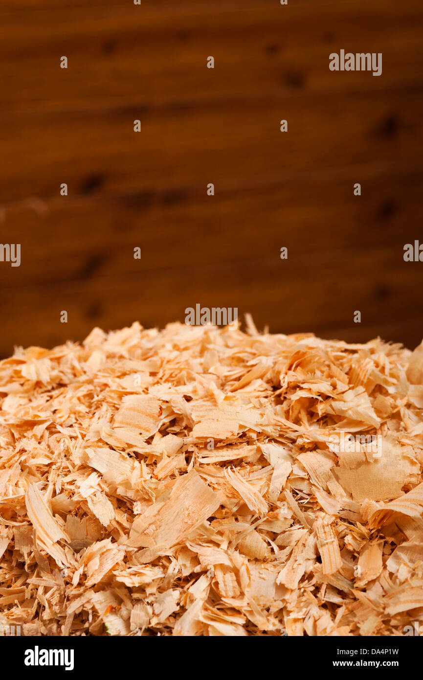 Close-up of a new bale of wood shavings in horse stall for bedding. Stock Photo