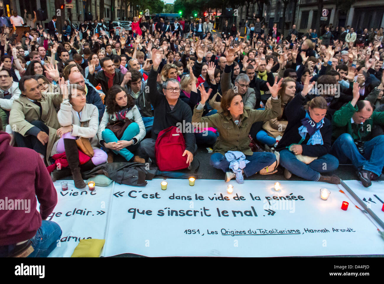 Pa-ris, France. Crowd of People Sitting on Street, Far Right, Conservative Group 'Les Vielleurs' Demonstration Anti-Gay Marriage, Occupy, religious meeting, different cultures religion, sit in Stock Photo