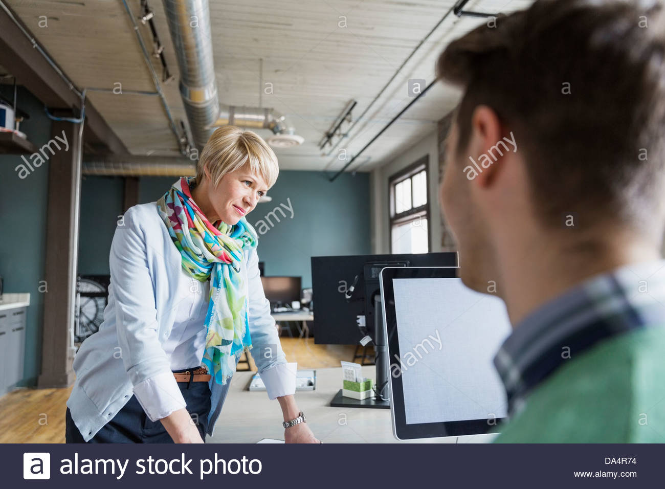 Entrepreneurs working in creative office space Stock Photo - Alamy