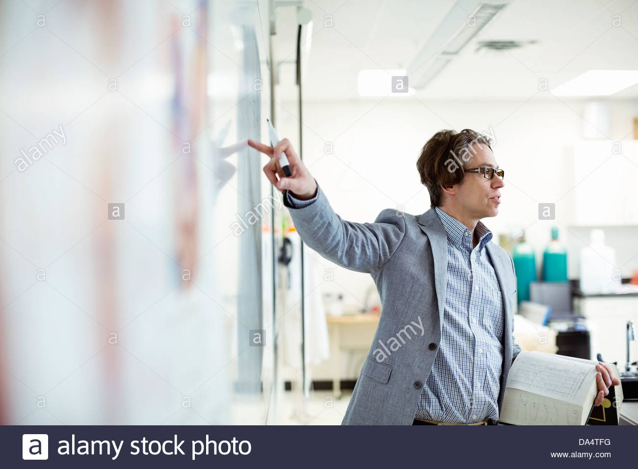 Male professor teaching in college science lab Stock Photo