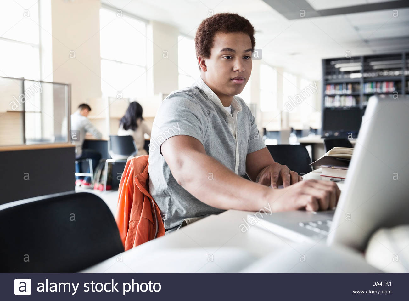 Male college student in library hi-res stock photography and images - Alamy