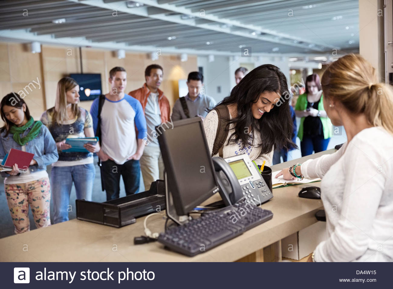 Young students registering for classes at college campus Stock Photo