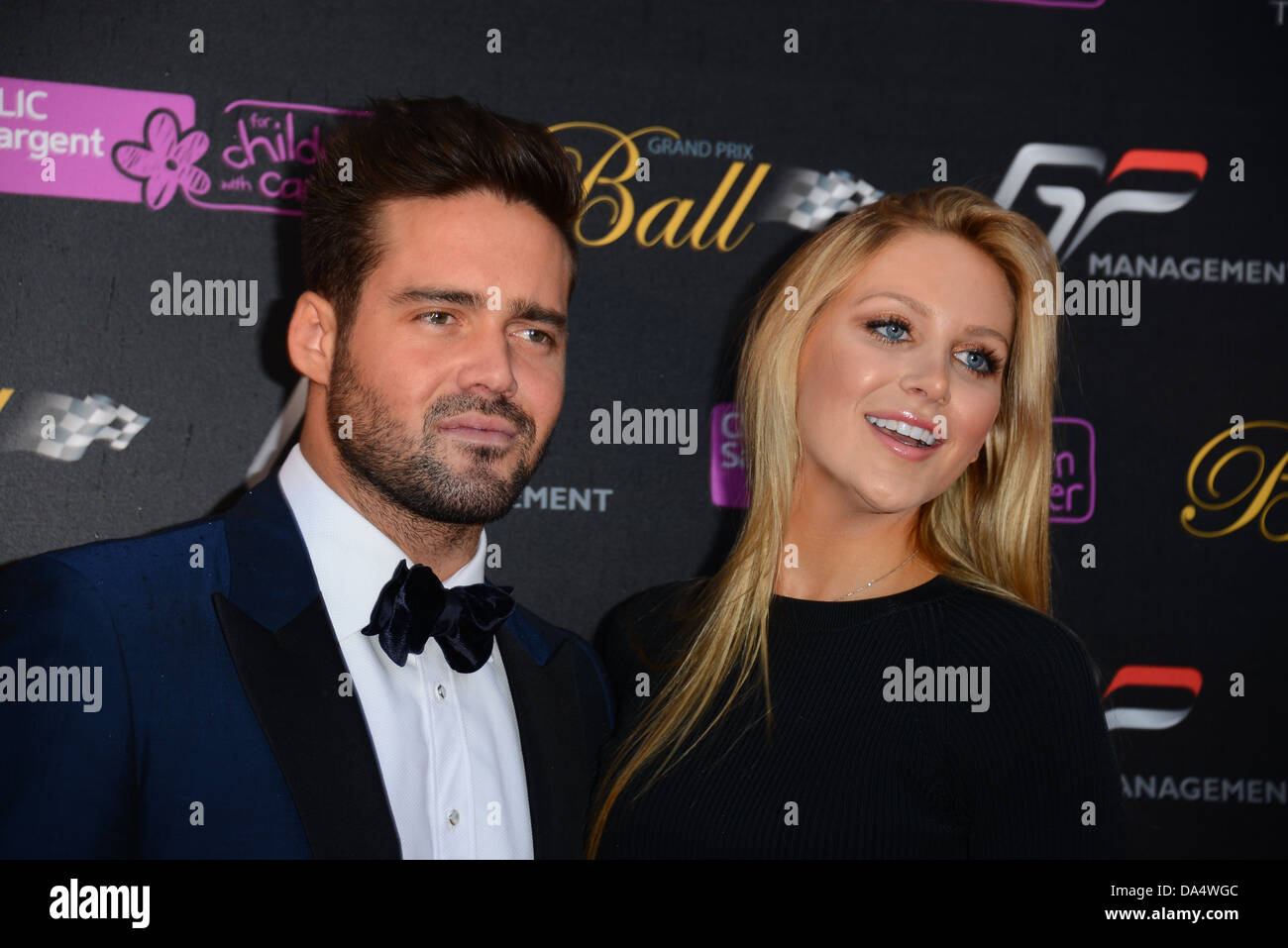 Spencer Matthews and a female guest arrive for the photocall at the Grand Prix Ball fundrises for children with cancer Stock Photo