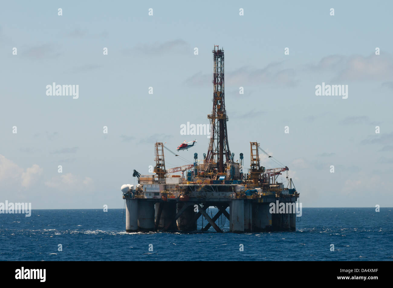Helicopter departing from Falcon 100 oil drilling rig offshore Rio de Janeiro, Brazil, working for Petrobras oil company Stock Photo