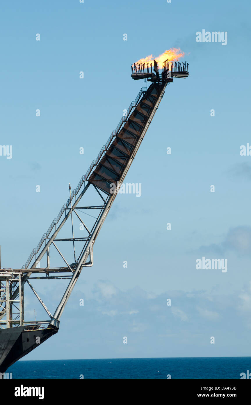 Gas flare of an offshore FPSO oil rig Stock Photo - Alamy