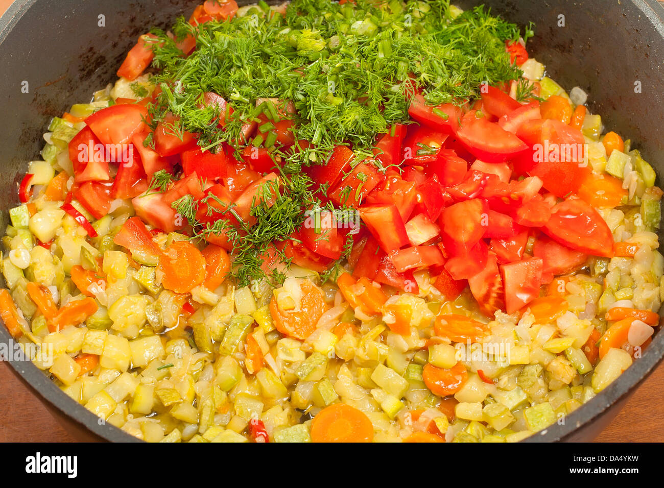 cooking saute courgettes in the cauldron Stock Photo