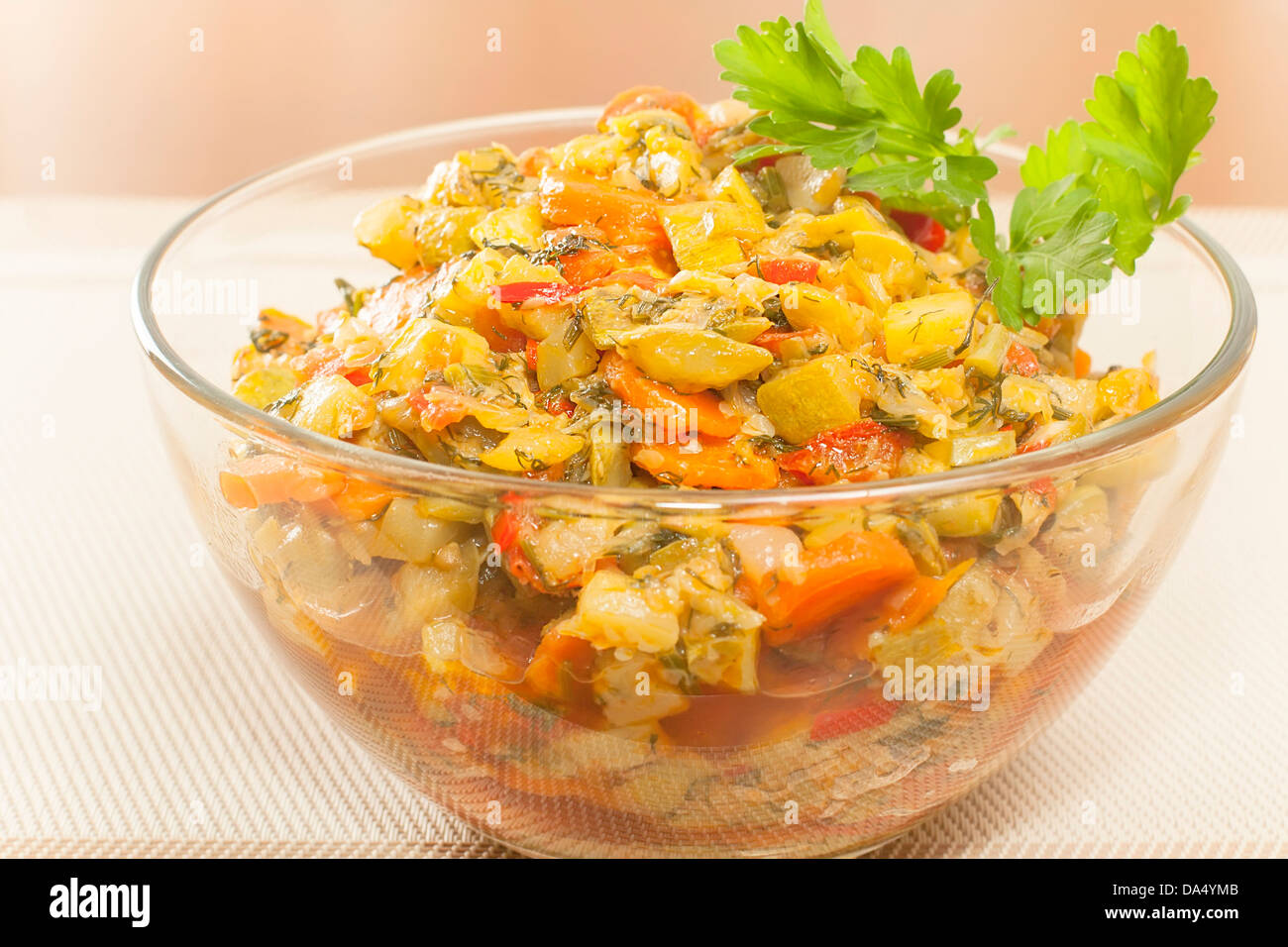 finished saute courgettes in a glass bowl closeup Stock Photo