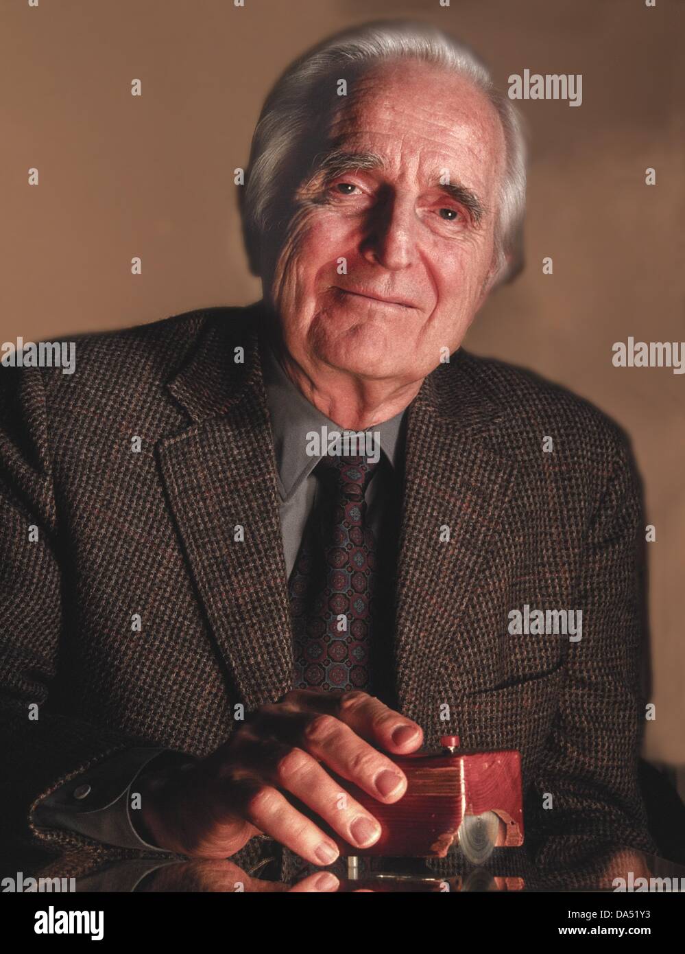 July 3, 2013 - FILE - DOUGLAS C. ENGELBART, one of the inventors of the computer mouse and a computer visionary, has died at the age of 88. PICTURED: July 8, 2004 - San Francisco, California, U.S - With his first prototype which was carved out of a wooden block, had wheels and a tiny red button. In 1970 he received a patent for the mouse pictured. (Credit Image: © Mark Richards/ZUMAPRESS.com) Stock Photo