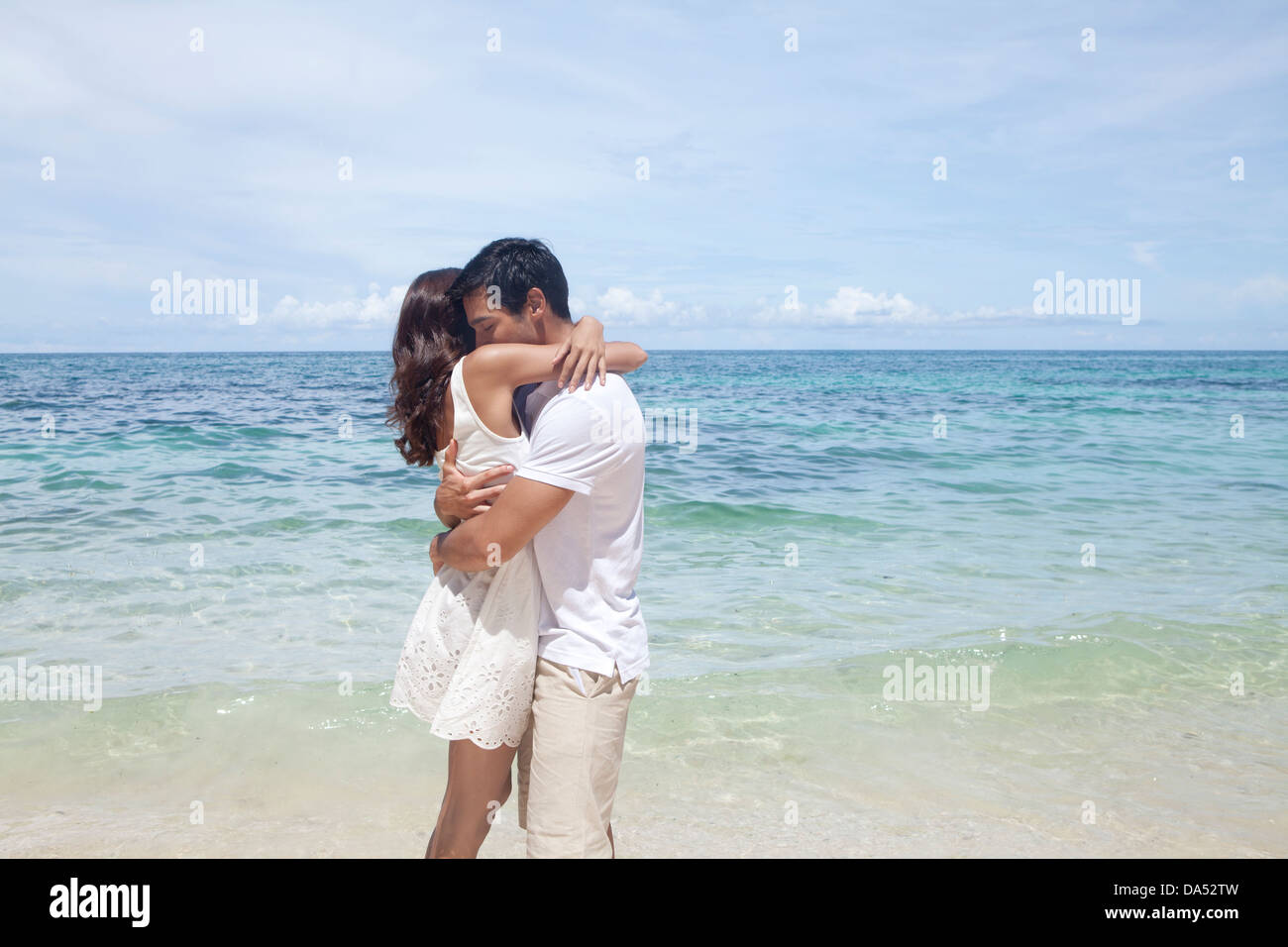 A young couple posing on a beach. Stock Photo