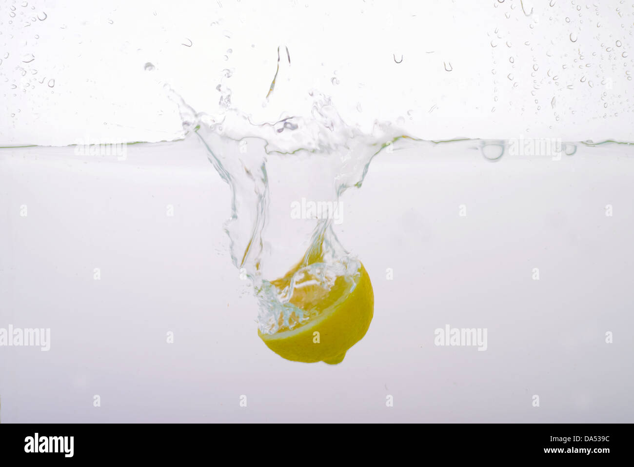 Splashed Lemon Lemon splashed into water Stock Photo - Alamy