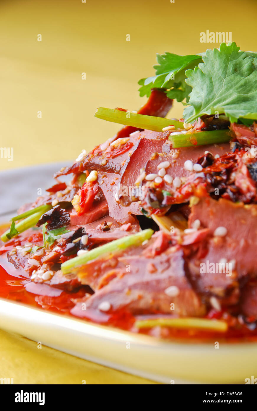 pork lungs in chili sauce, sesame on it Stock Photo - Alamy