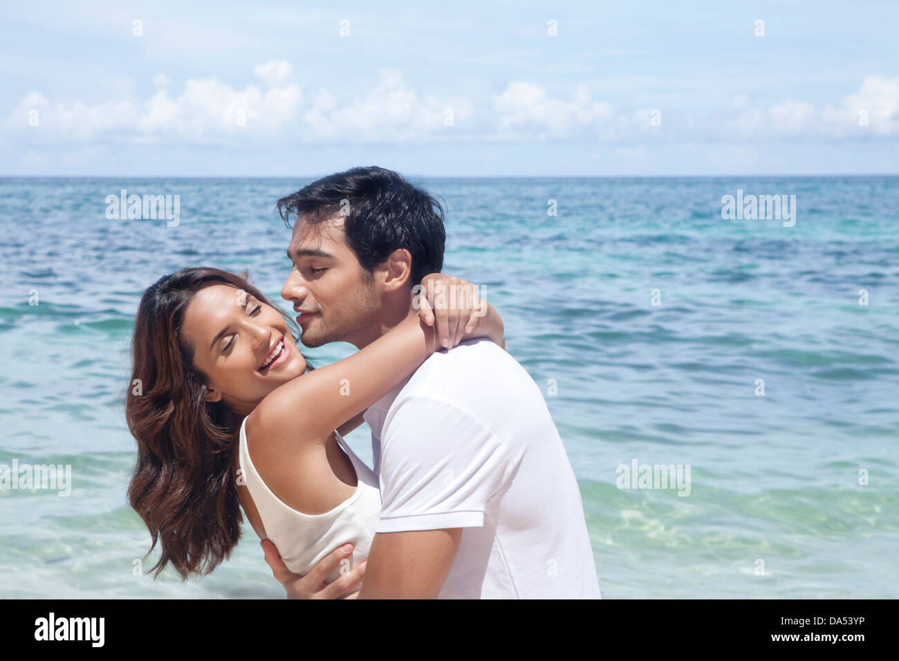 A young couple posing on a beach. Stock Photo