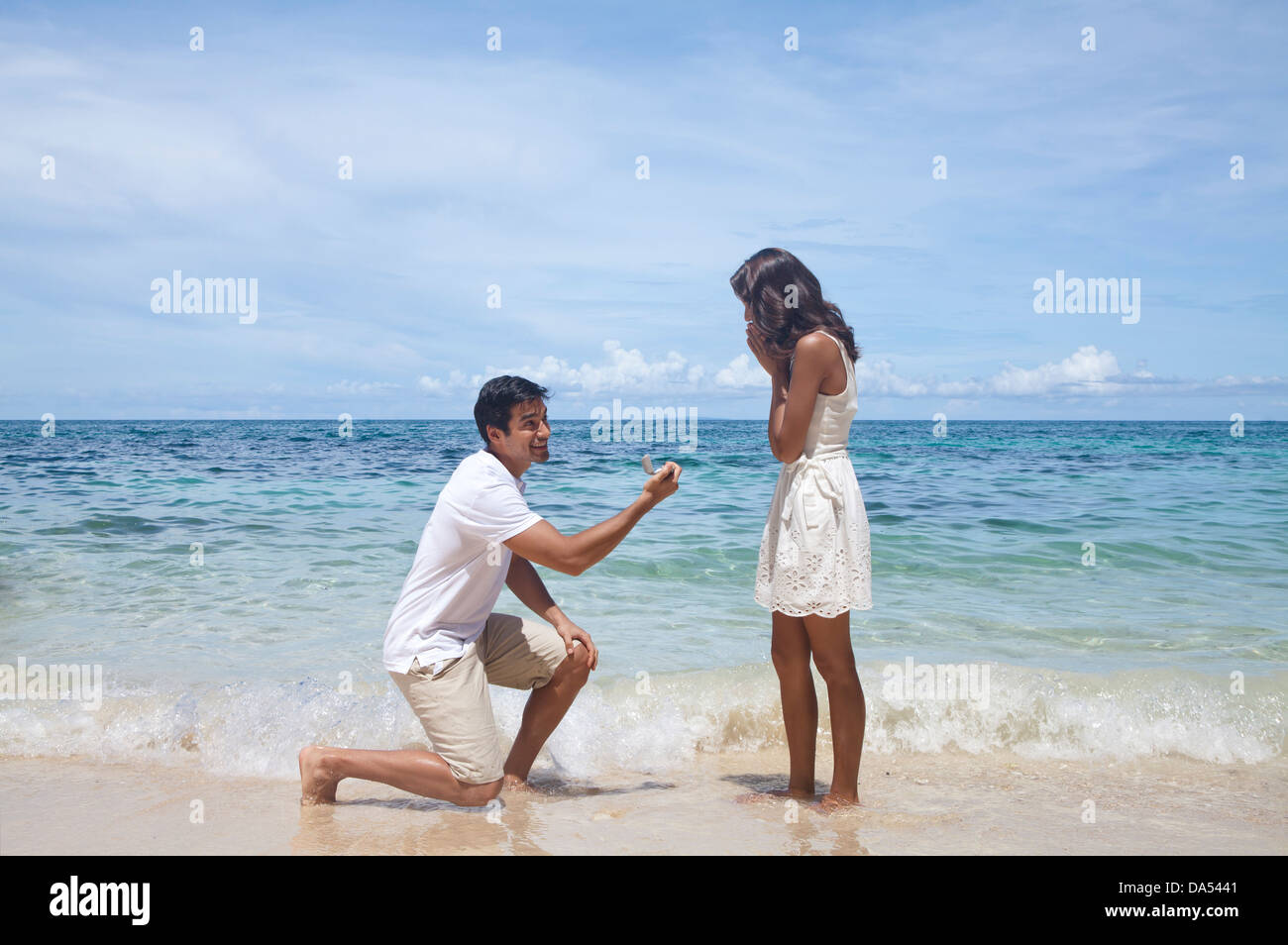 A young couple posing on a beach. Stock Photo