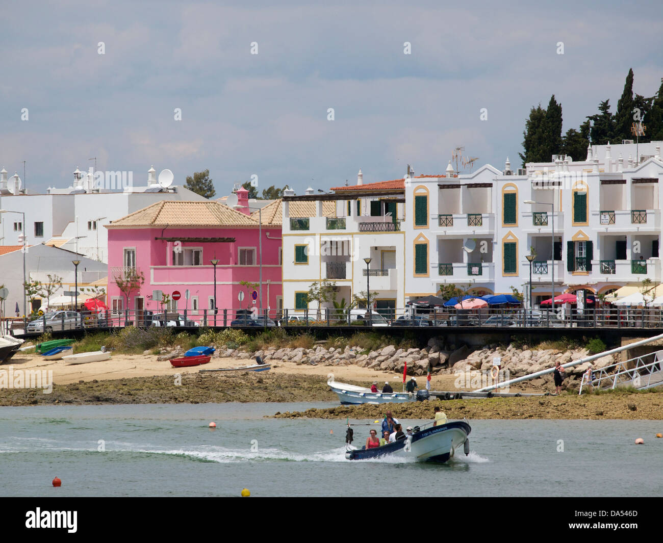 The town of Cabanas de Tavira with small boat taking tourists to the