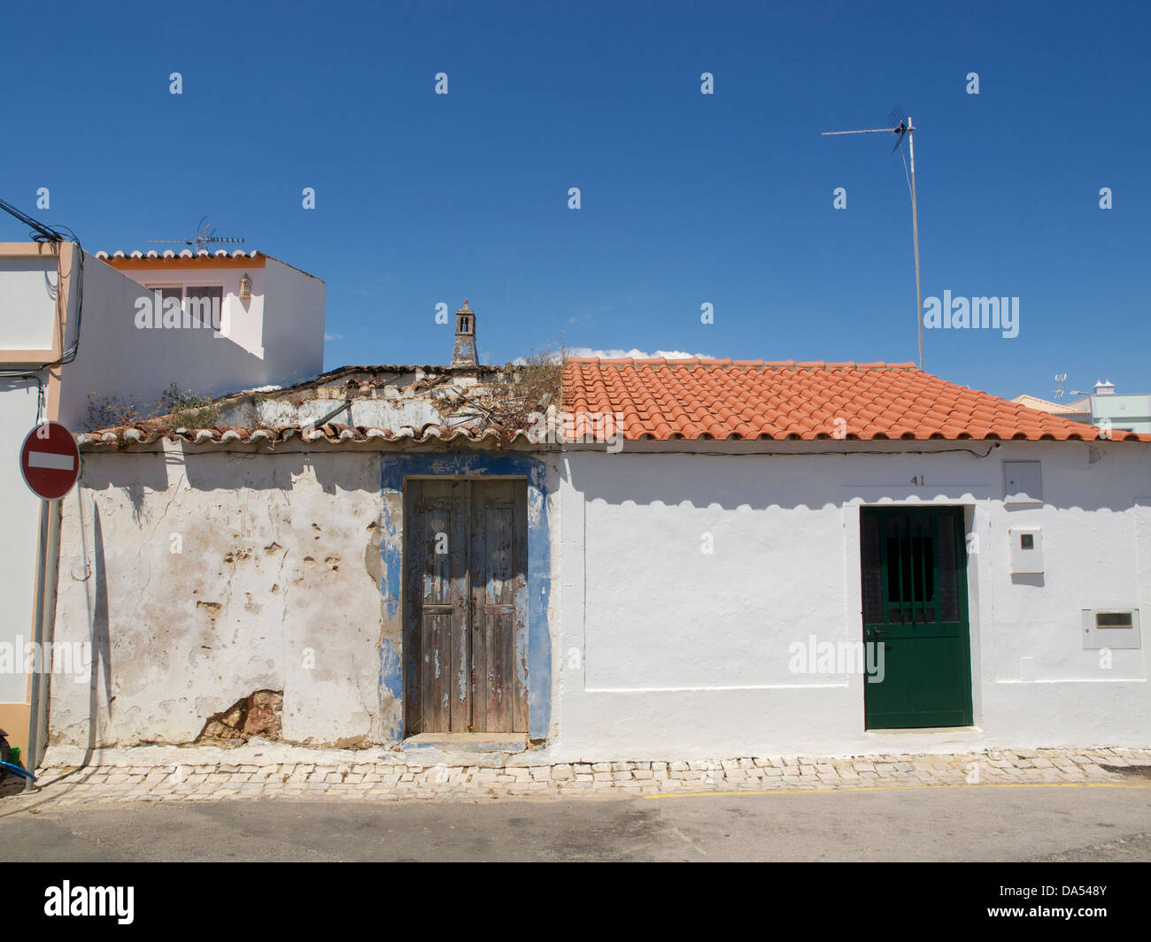 renovated and delapidated attached houses, Cabanas de Tavira, Portugal