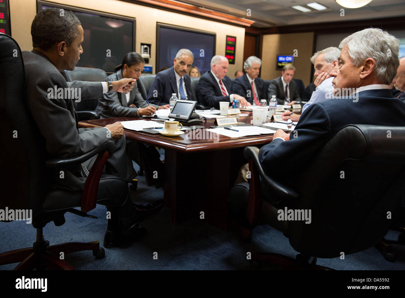 US President Barack Obama meets with members of his national security team to discuss the political crisis in Egypt in the Situation Room of the White House July 3, 2013 in Washington, DC. Stock Photo