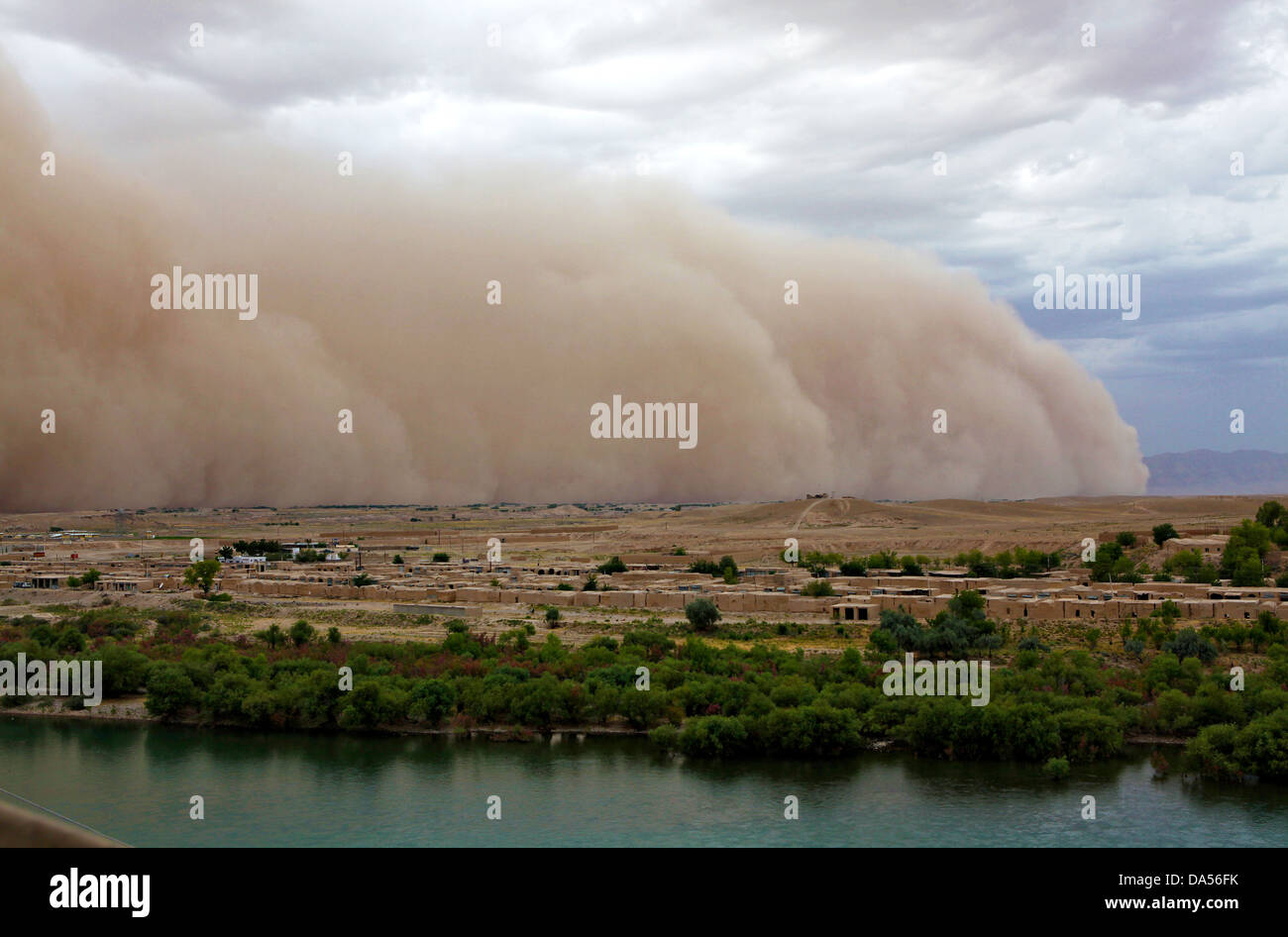 A massive dust storm rolls through the Kajaki Bazaar June 3, 2013 in Zeebruge, Helmand province, Afghanistan. Stock Photo