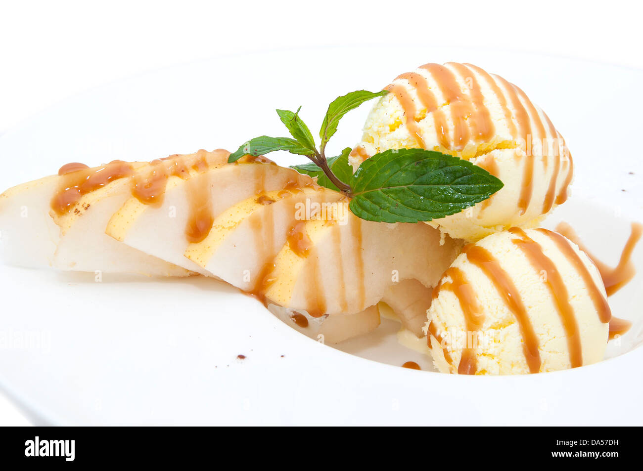 ice cream with caramel sauce and mint on a white background Stock Photo ...