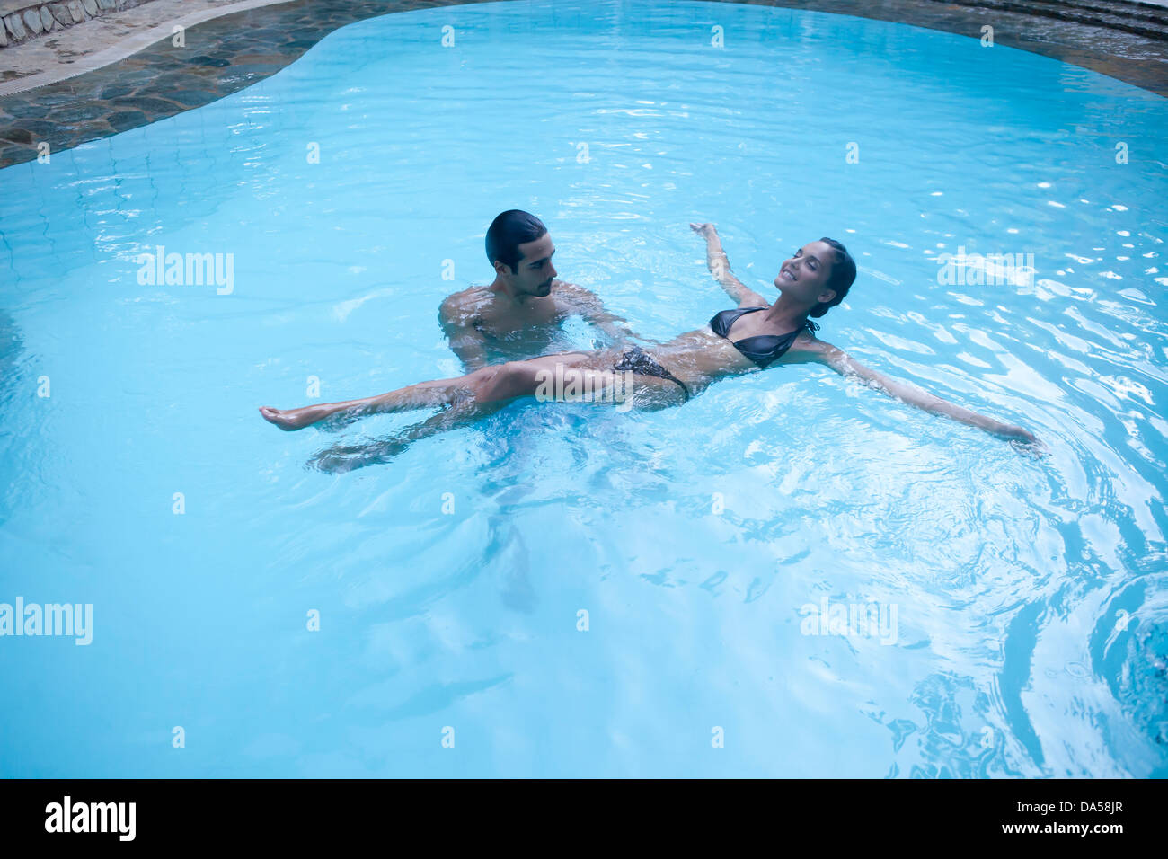 A young couple swimming. Stock Photo