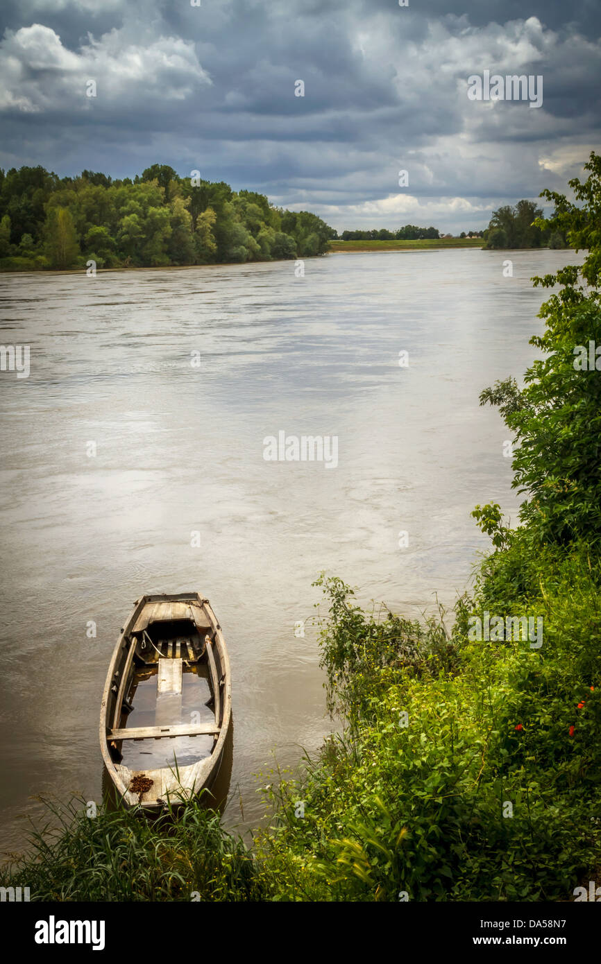Solitary canoe on river, France. Stock Photo