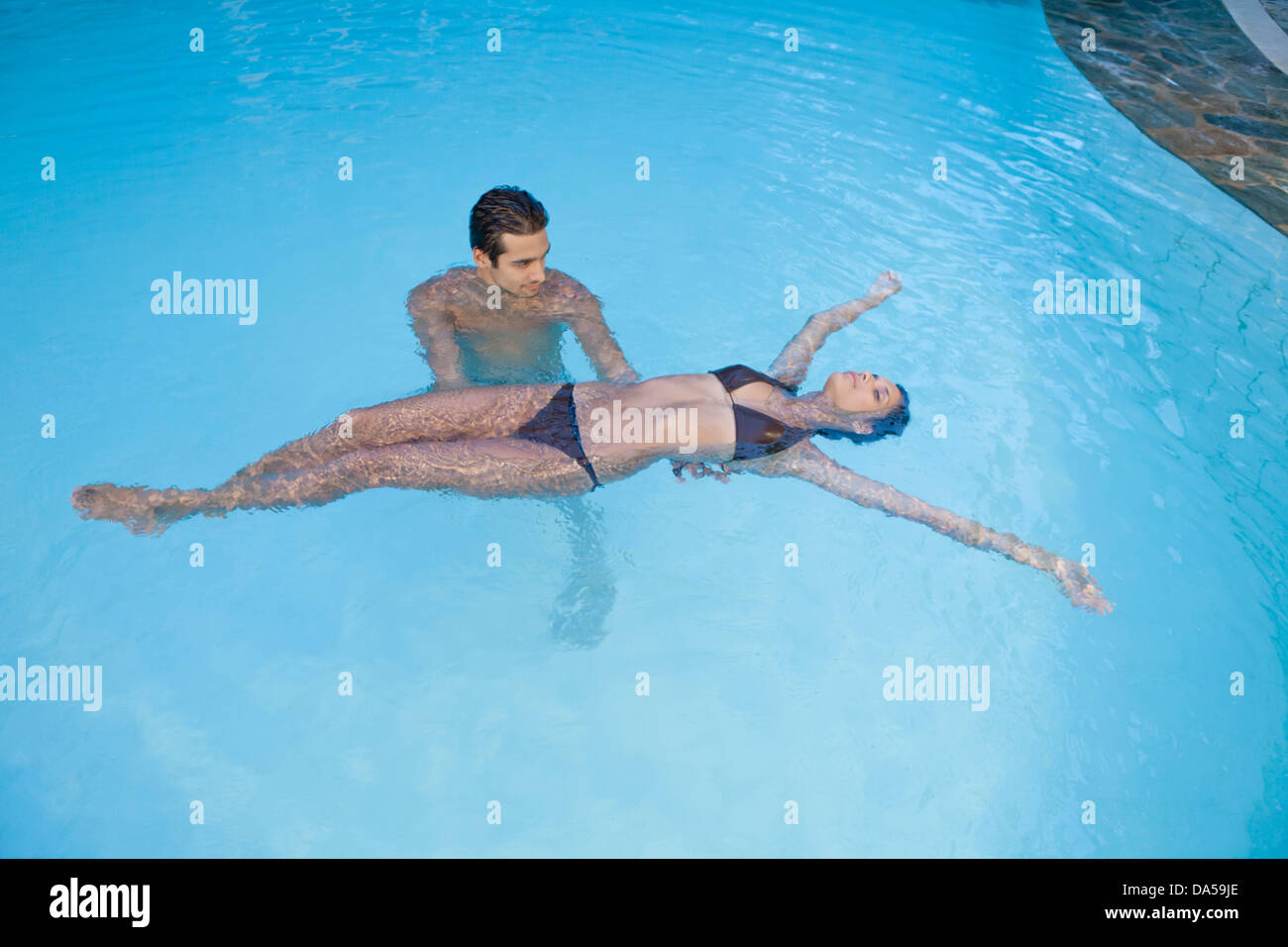 A young couple swimming. Stock Photo