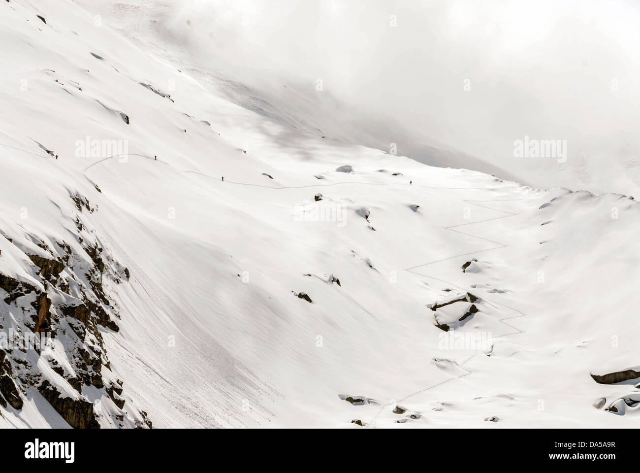 Skiers, ski trails, French Alps, Chamonix Mont Blanc, Aiguille du Midi Stock Photo