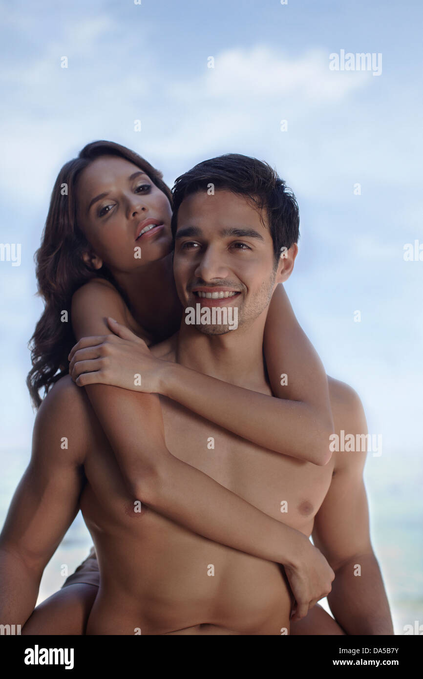A couple embracing on a beach. Stock Photo