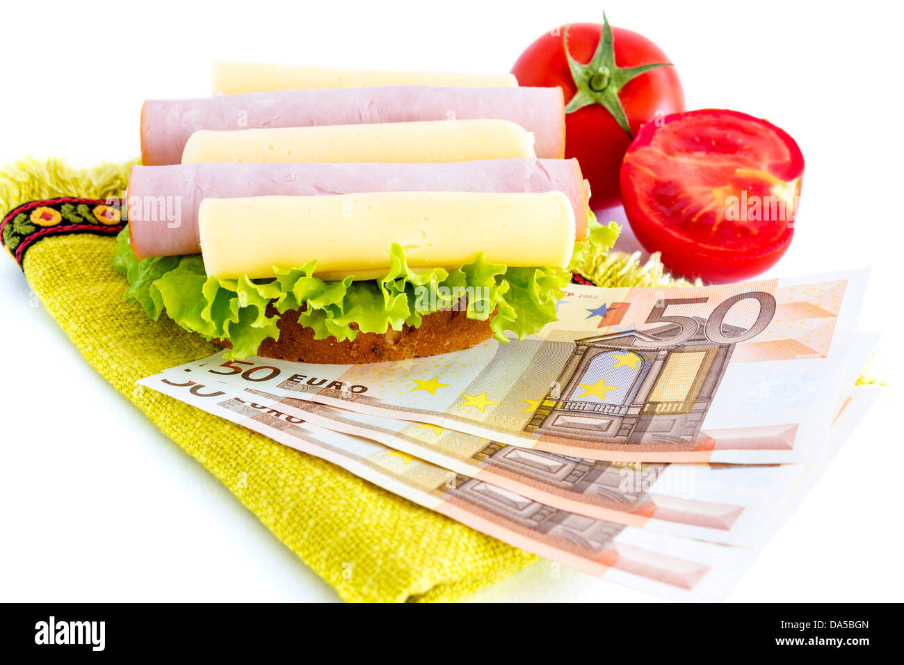 Sandwich and money which represents the hunger for money Stock Photo