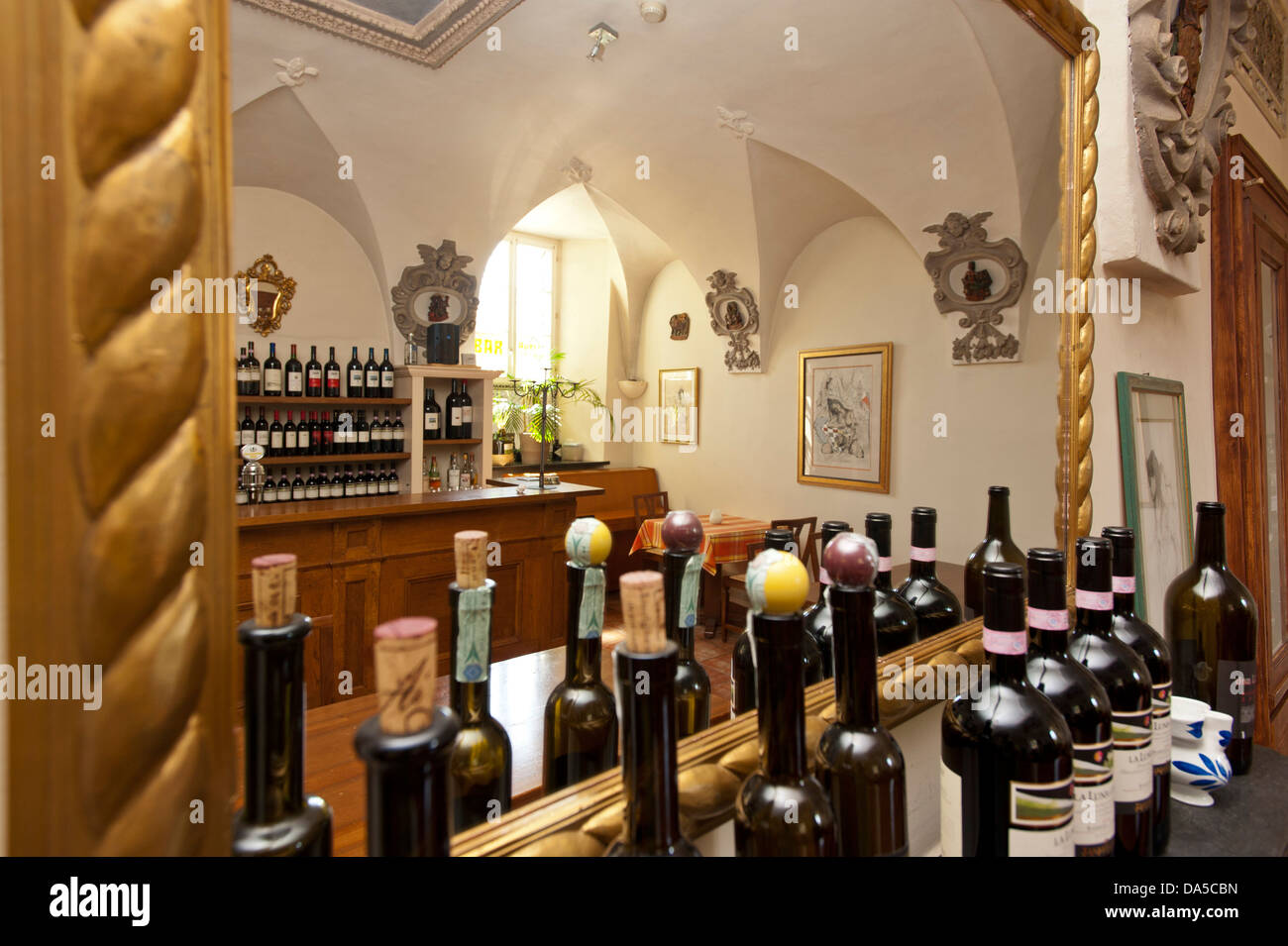Switzerland, Europe, Ticino, Ascona, Ristorante Borromeo, restaurant, mirror, wine bottles, golden Stock Photo