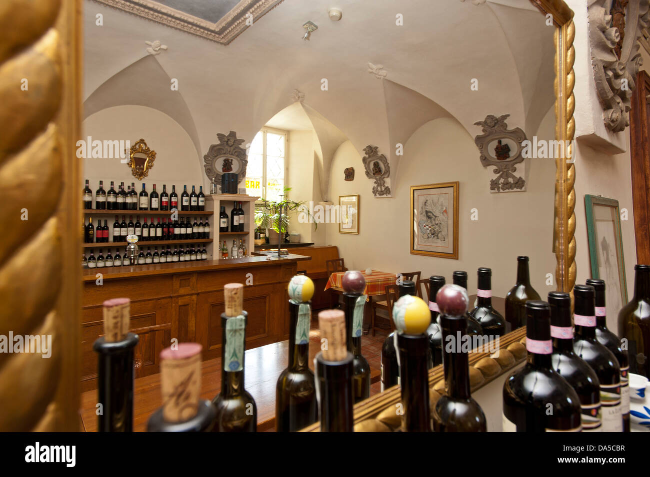 Switzerland, Europe, Ticino, Ascona, Ristorante Borromeo, restaurant, mirror, wine bottles, golden Stock Photo