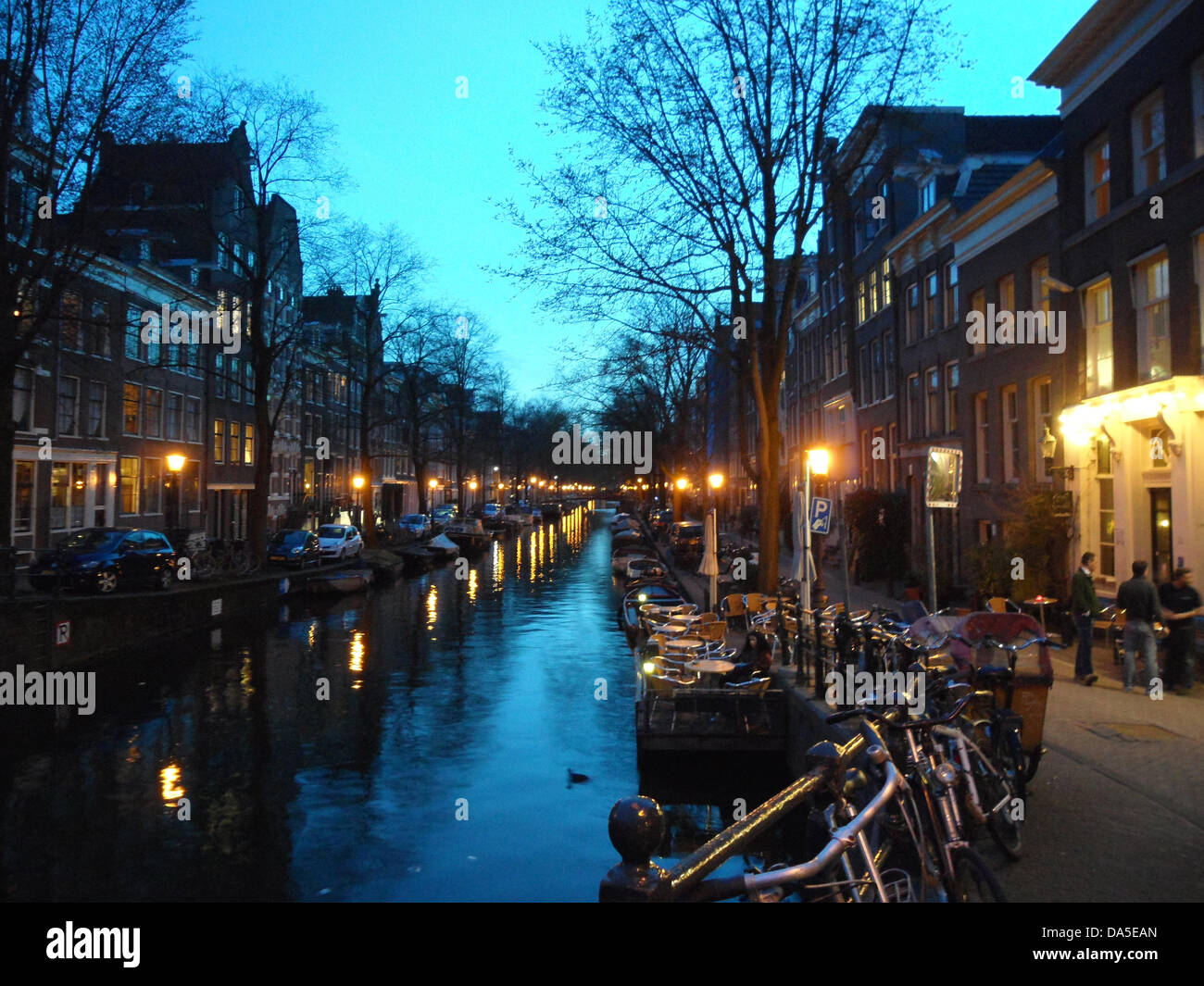 Twilight - Crepuscule over the canal near the popular Bruine Cafe 't SMALLE at the Corner Egelantiers- and Prinsengracht with a terrace on the water in the charming quarter Jordaan in Amsterdam.????? Stock Photo