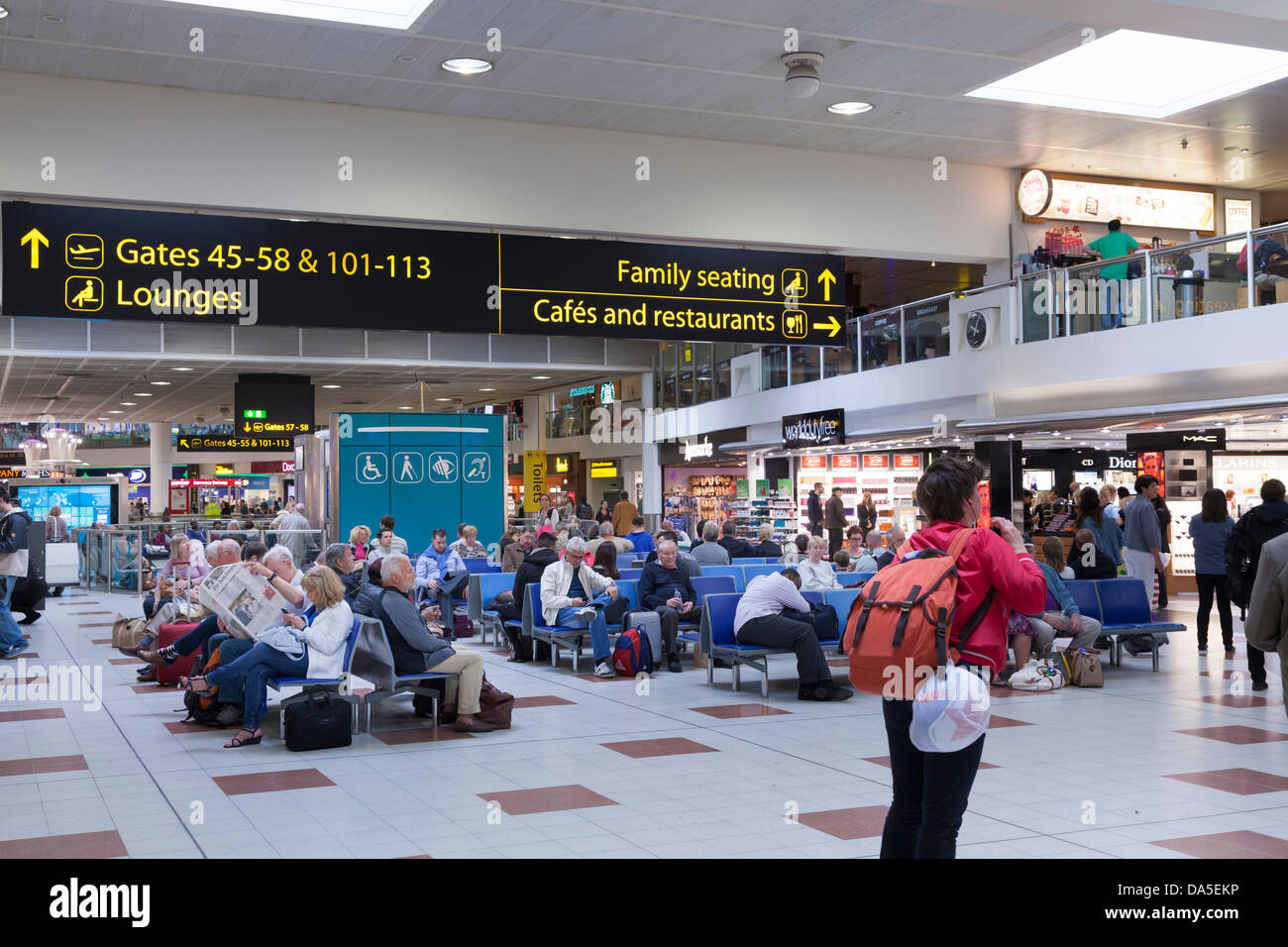 Gatwick airport departure lounge and direction signs Stock Photo - Alamy