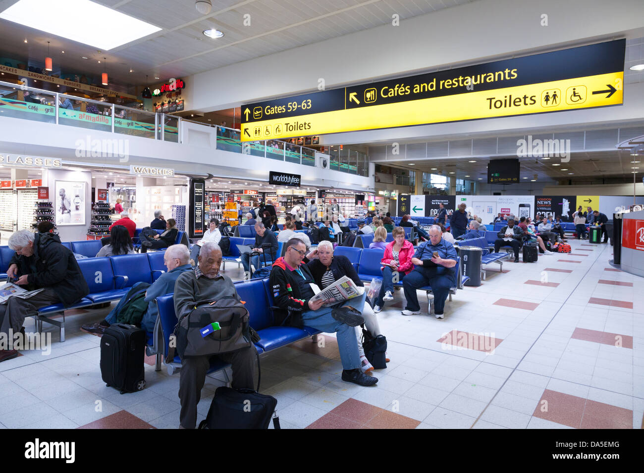 Gatwick airport departure lounge and direction signs Stock Photo - Alamy