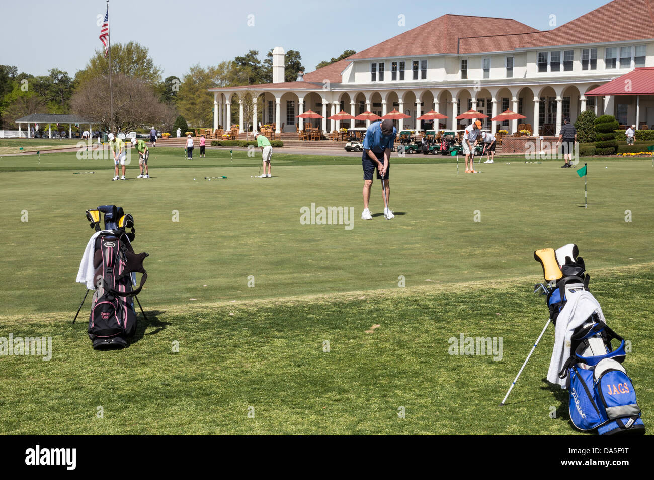 Golfers on Practice Putting Green, PInehurst Resort Golf Course, Pinehurst, North Carolina, USA Stock Photo