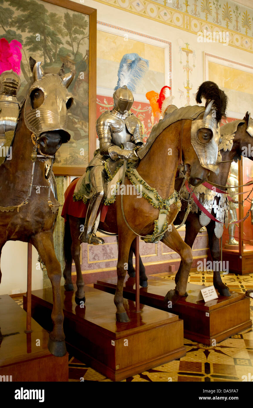 Models of horses wearing military armour in the State Hermitage Museum, a museum of art and culture in St Petersburg. Stock Photo
