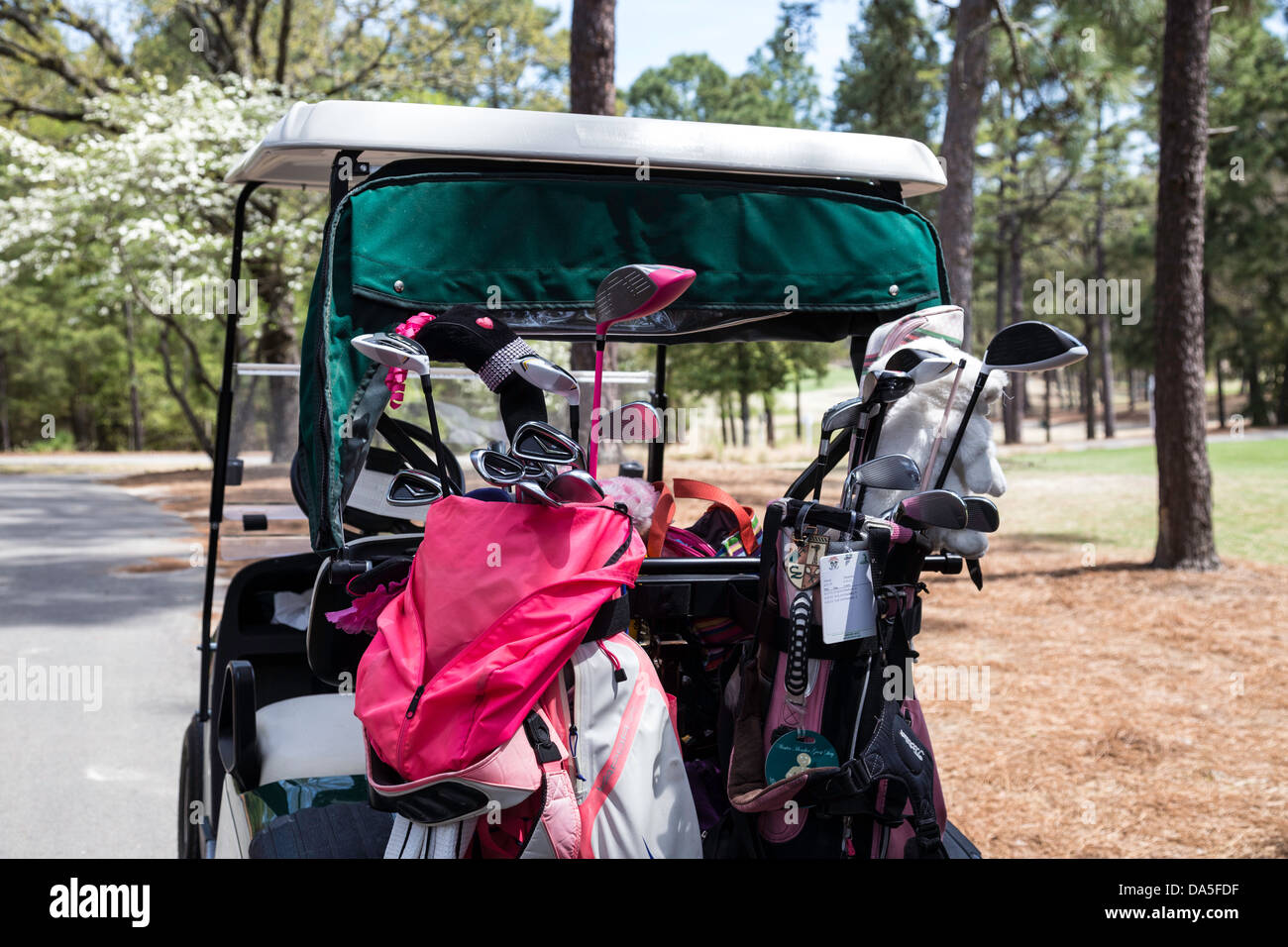 Golf Cart Parked at a green in PInehurst Resort Golf Course, Pinehurst, North Carolina, USA Stock Photo