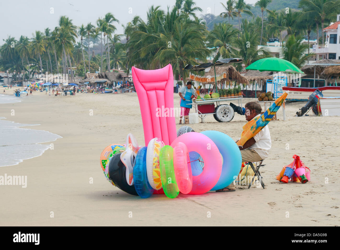 Beach selling inflatable toys on Los Ayala beach, Stock Photo - Alamy