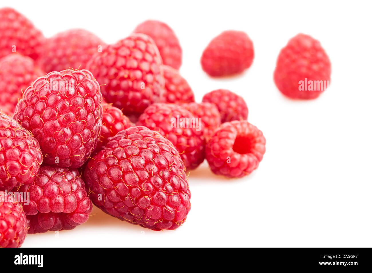 raspberry heap scattered on white background Stock Photo