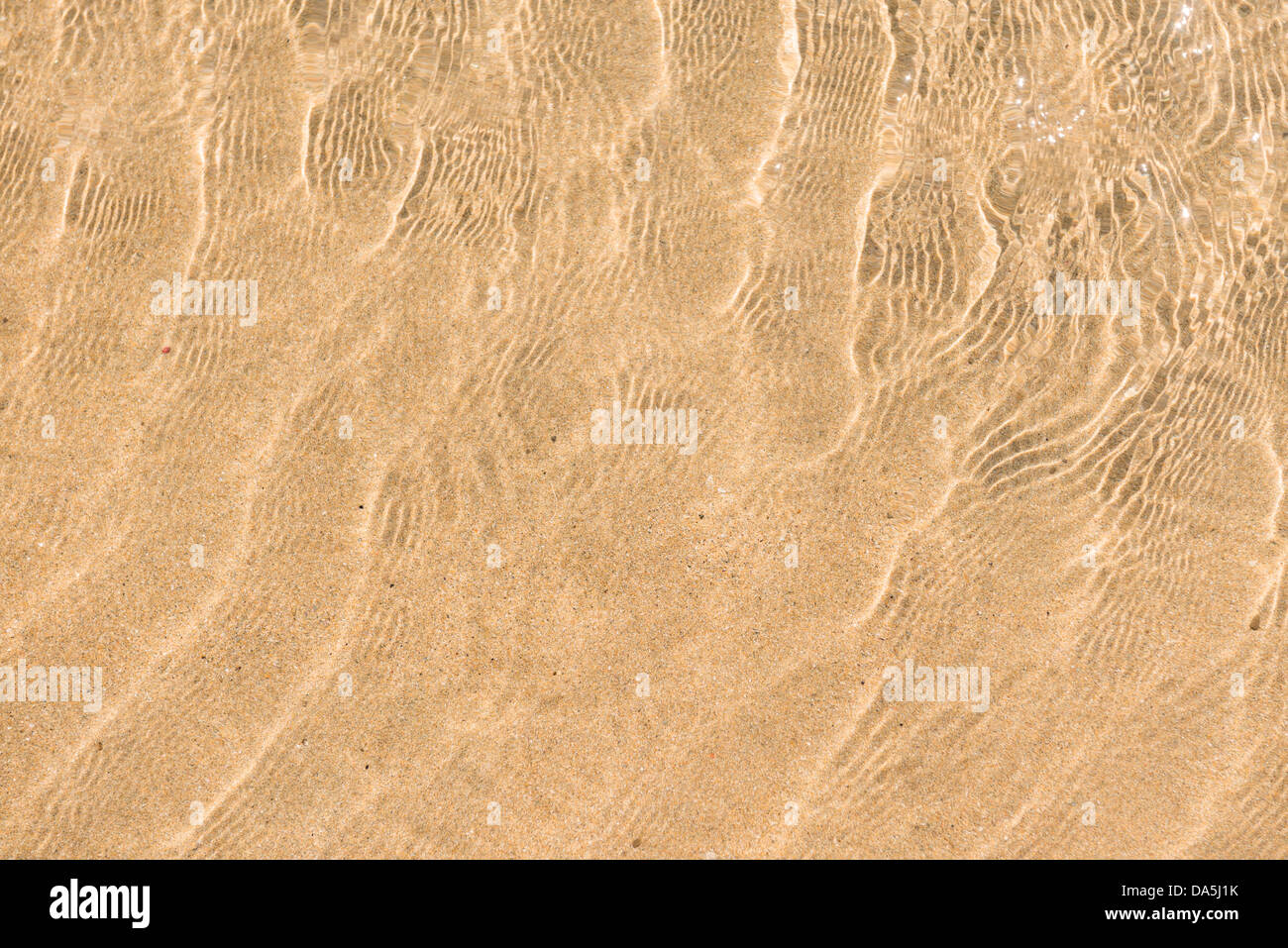 Ripples in clear shallow water at Newquay Cornwall Stock Photo - Alamy