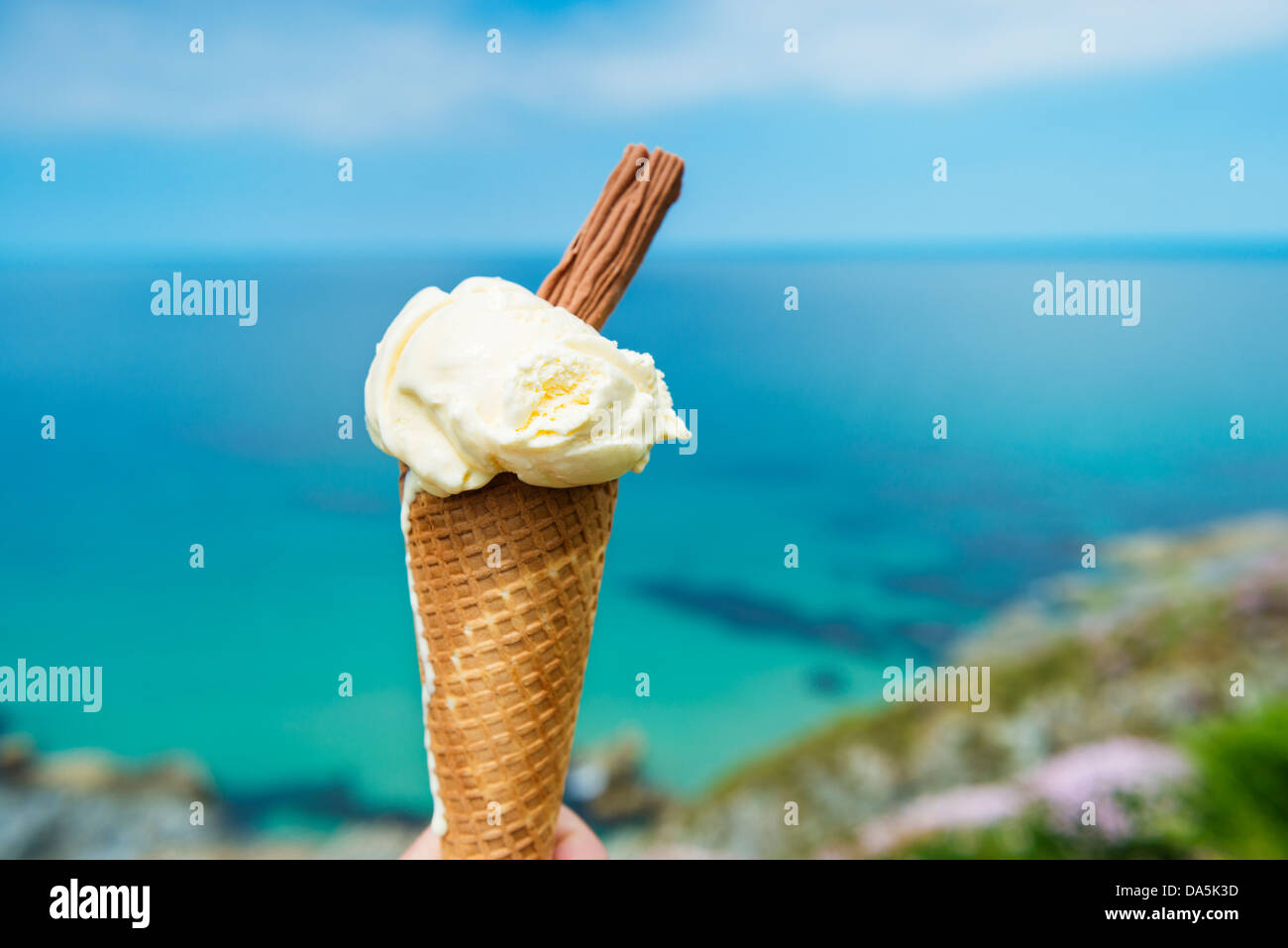 Ice cream at Pentire headland Newquay, Cornwall against bright blue sea