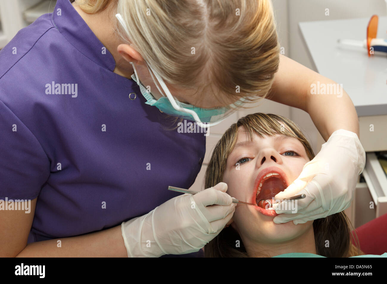 dentist check young girl teeth Stock Photo Alamy