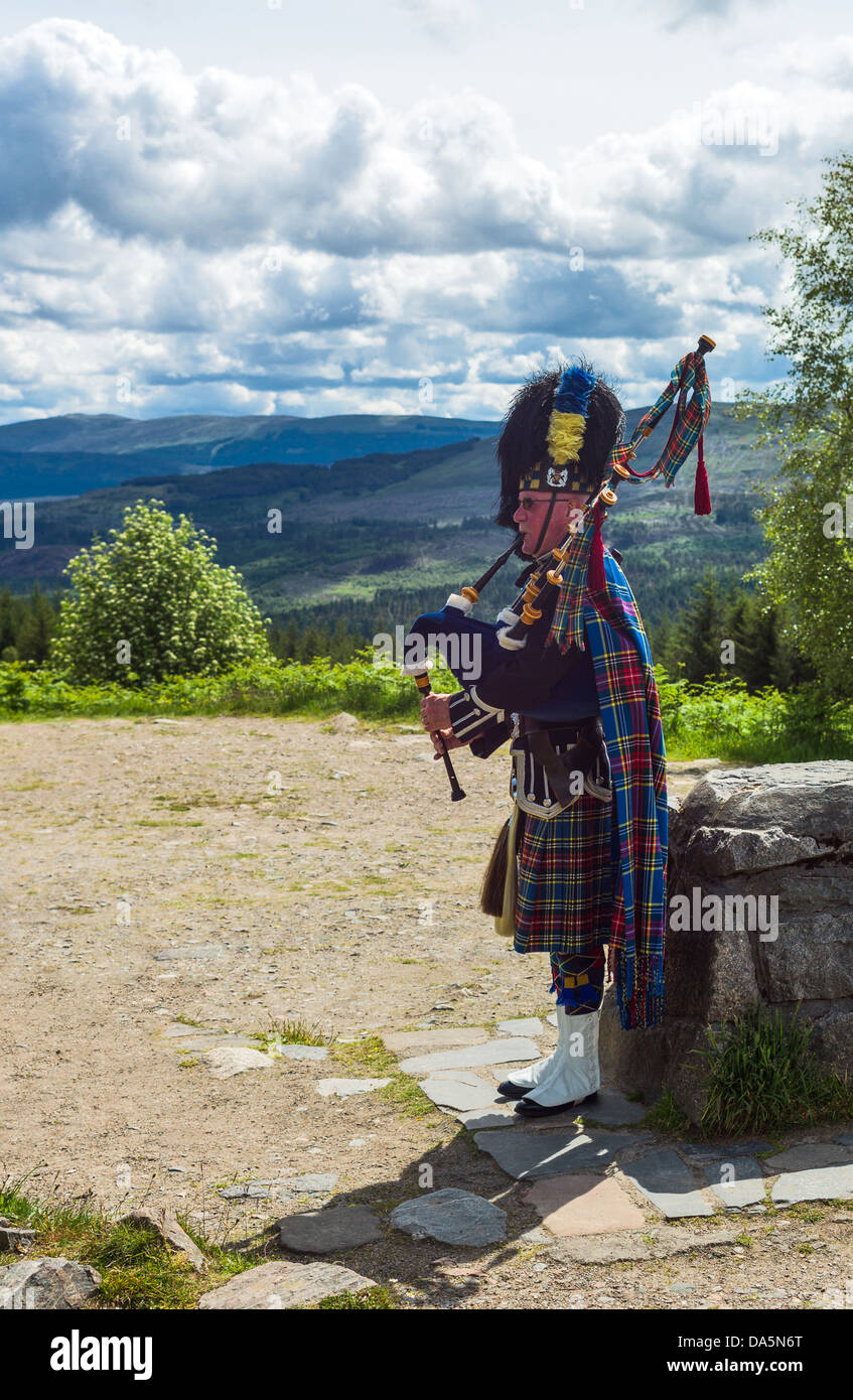 Europe Great Britain, Scotland, Highlands, a bagpipe player in the Lochash area near the Eilean Castle. Stock Photo