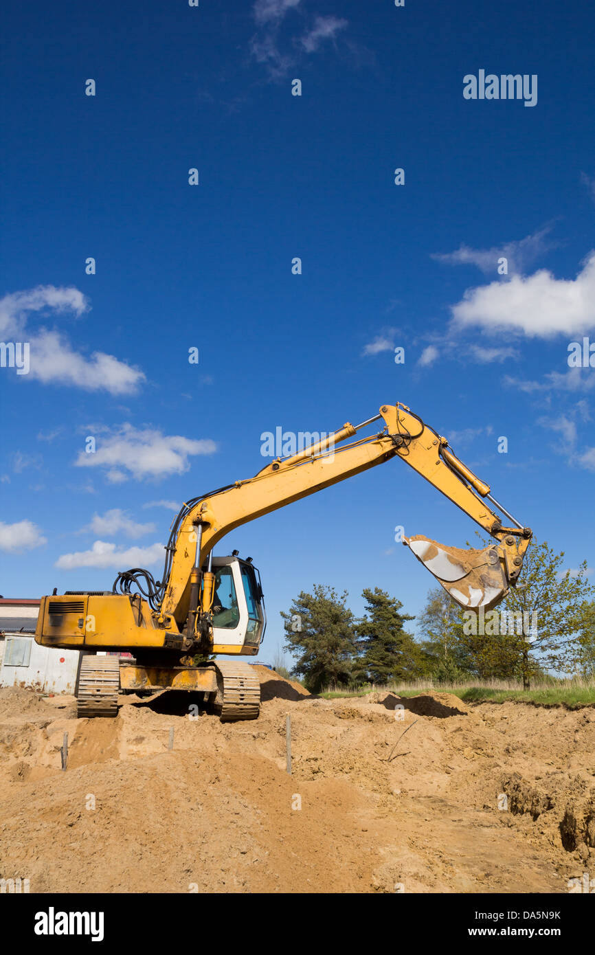 excavators working on a construction site Stock Photo - Alamy