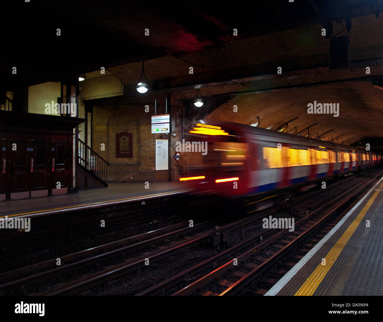 Hammersmith & City Line train leaving platform, Baker Street Station, London, England, United Kingdom Stock Photo