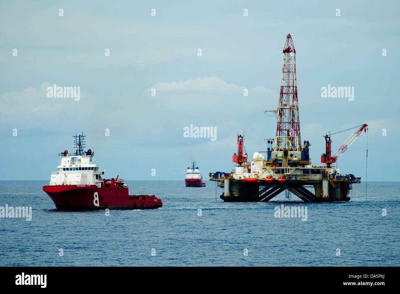 Supply vessel close to an offshore oil rig at campos basin, brazil Stock Photo