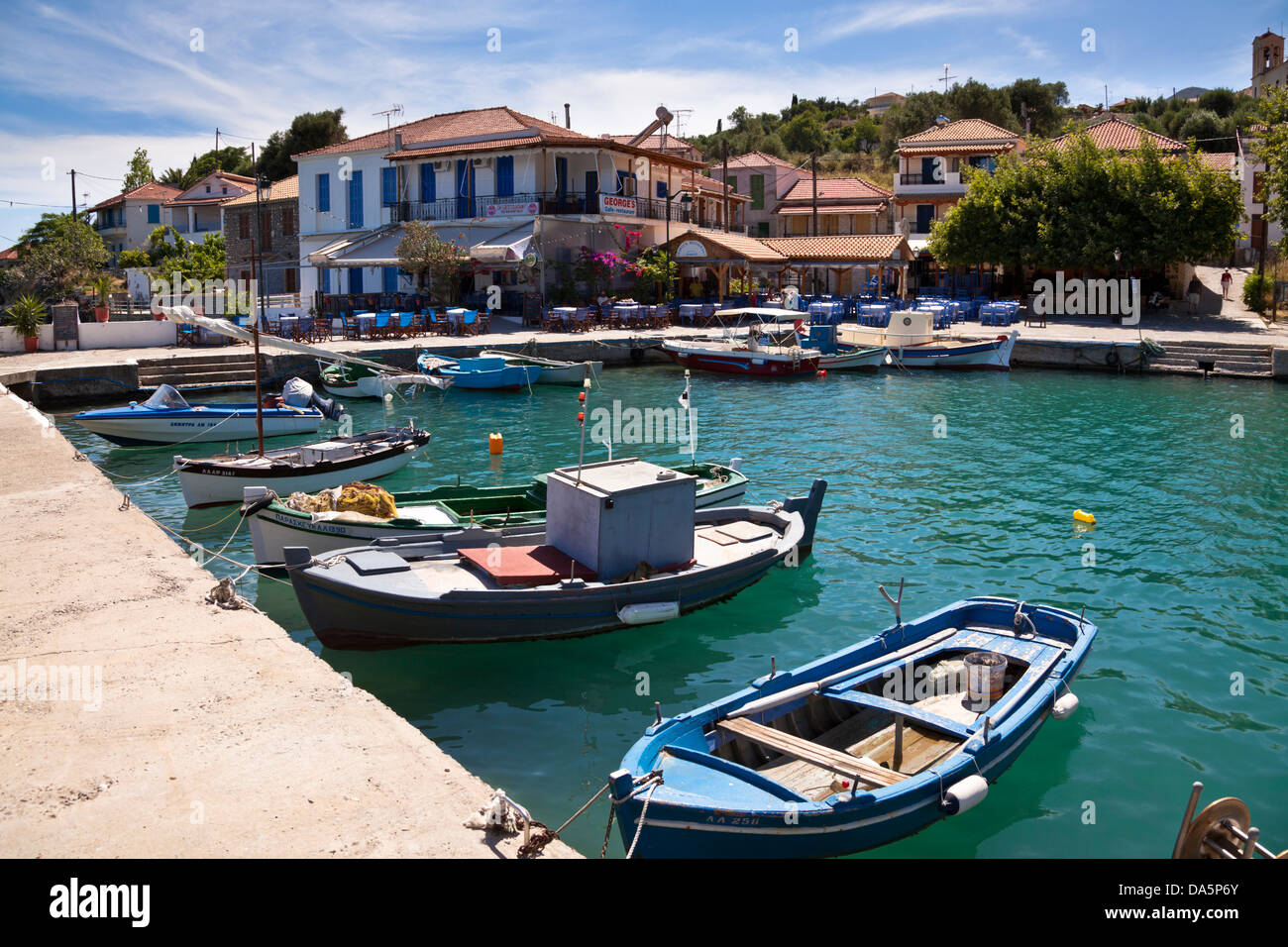 Local fishing boats moored in the harbour at Kalamos, Greece Stock Photo